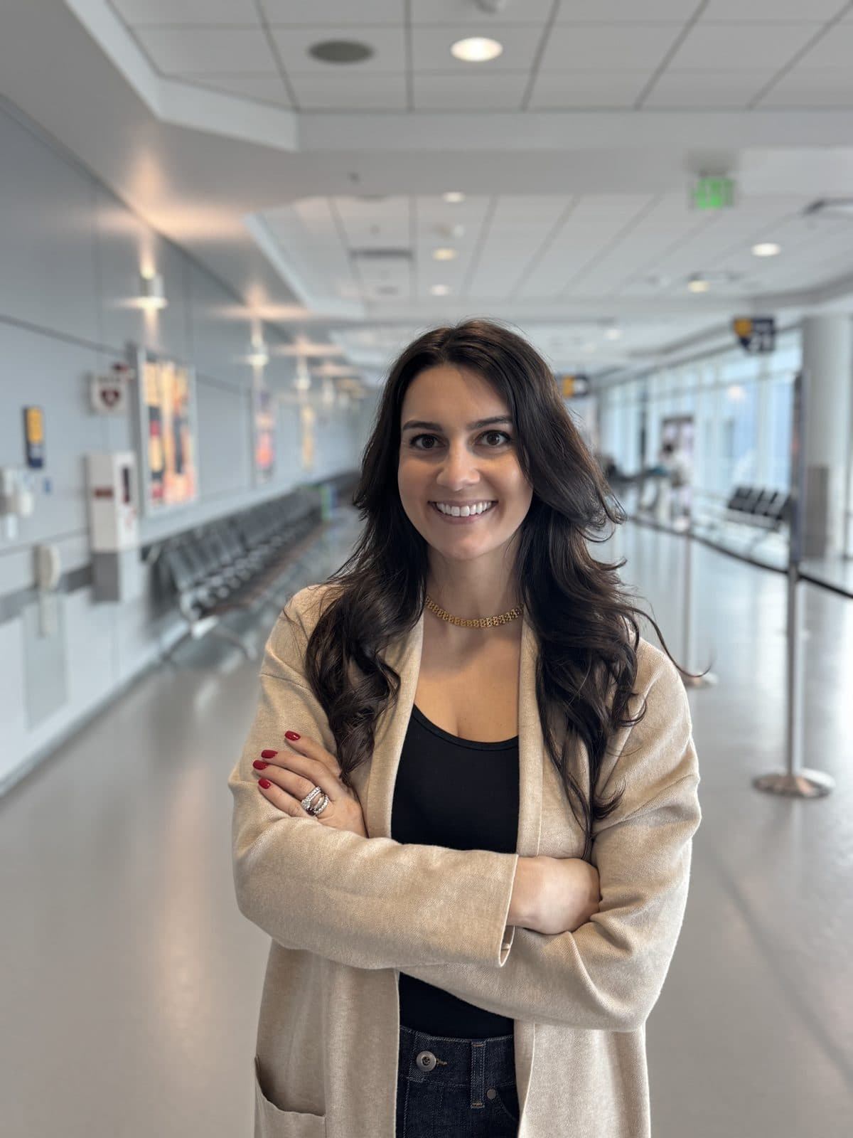 Lia Tuso standing in an airport terminal